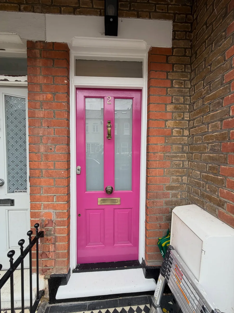 Hand-painted front door against period brickwork by Highly Decorated