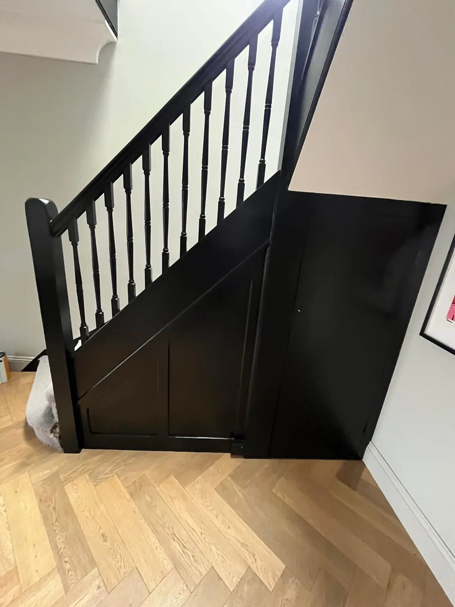 Hand-finished mirror-black staircase by Highly Decorated Limited
